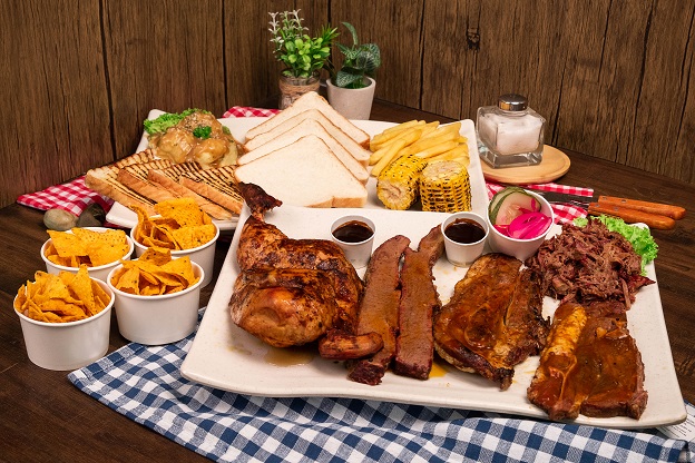 A platter of Mix BBQ Meat with Side dishes